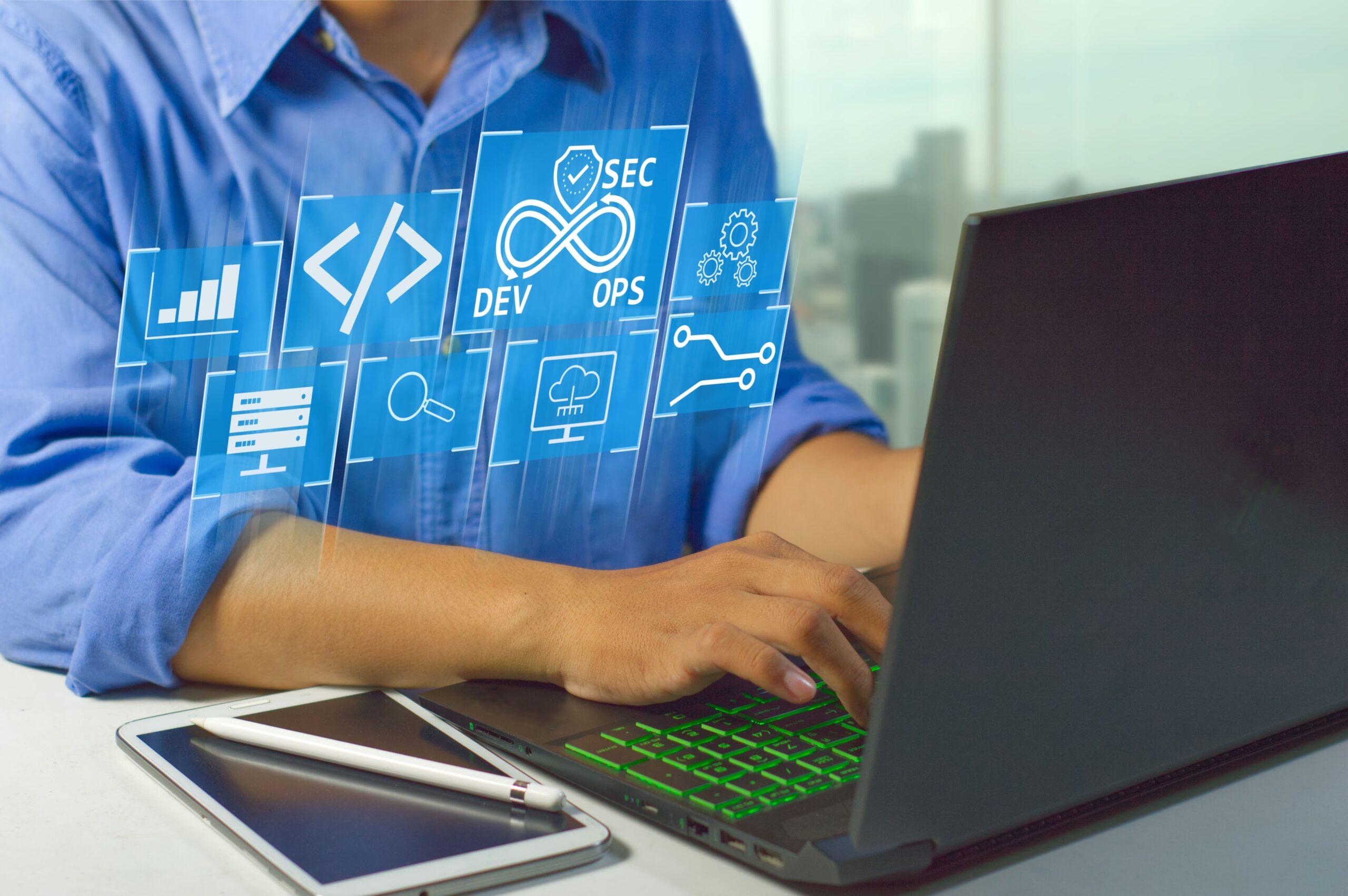 Man on laptop with DevSecOps iconography